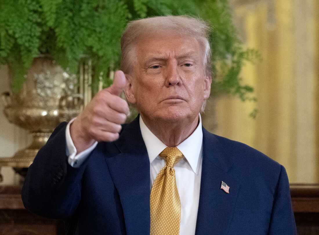 President Trump gestures to the press at the end of a reception with Republican members of Congress at the White House on July 22, 2025.