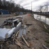 An abandoned vehicle sits along the Swannanoa River in a landscape scarred by Hurricane Helene, on March 24, near Swannanoa, N.C.