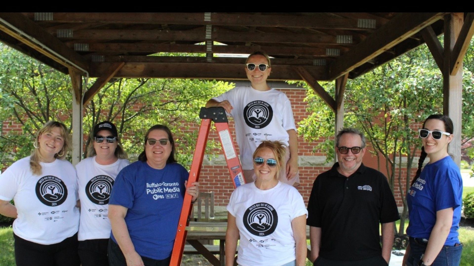 BTPM staff gathered around a ladder for United Way's Day of Caring