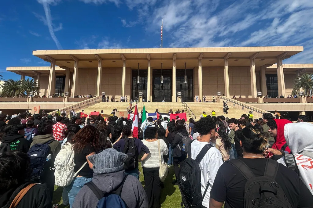 Students and staff protest President Donald Trump’s immigration policies in front of the University Library at Cal State Northridge on Feb. 19, 2025. The demonstrators, led by the group CSUN Students Organizing Against Repression, called on university administration to declare the university a “sanctuary campus.” Photo by Delilah Brumer, CalMatters