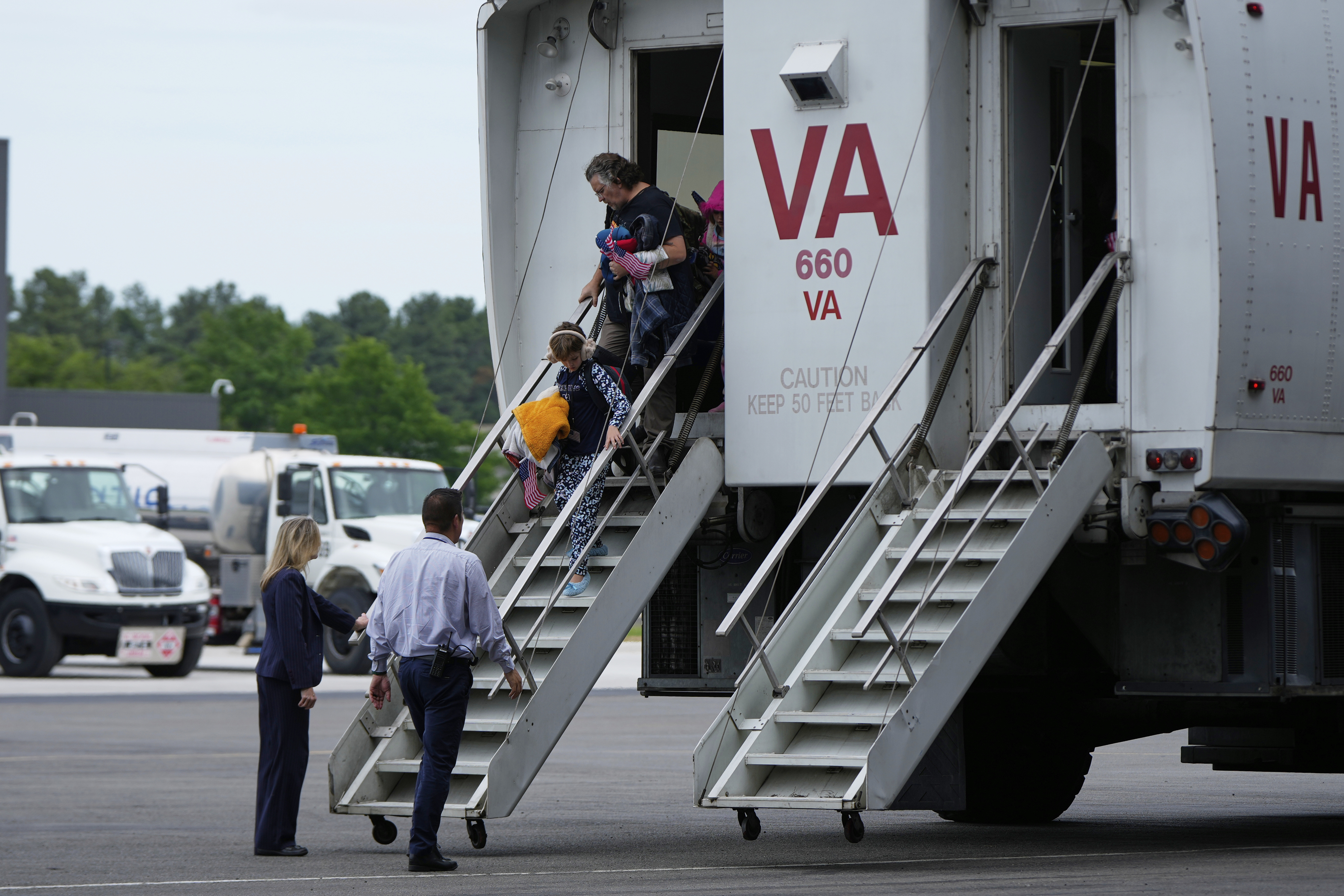 Afrikaner refugees from South Africa, arrive Monday, May 12, 2025, at Dulles International Airport in Dulles, Va.