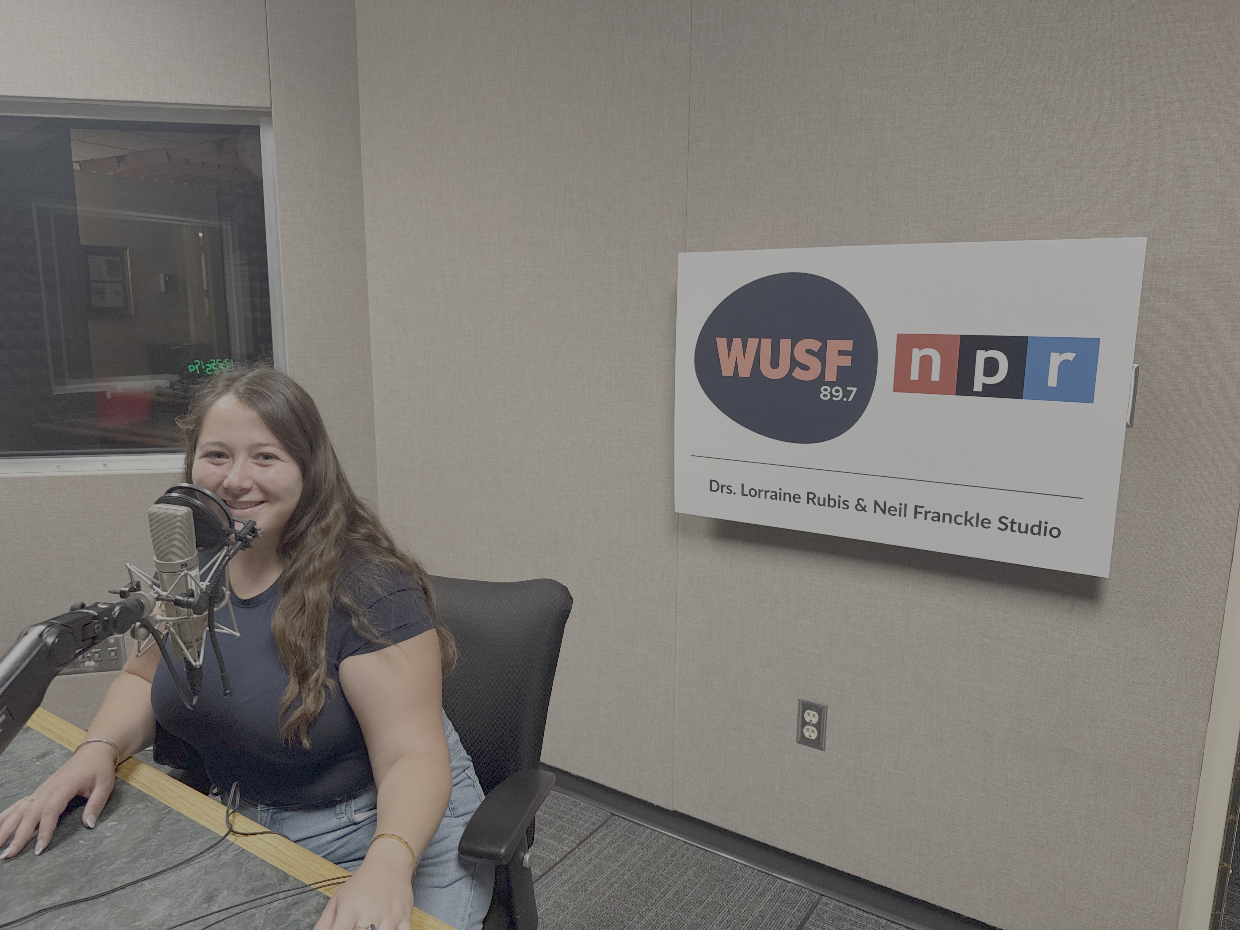 Group of students seated at the WUSF roundtable studio