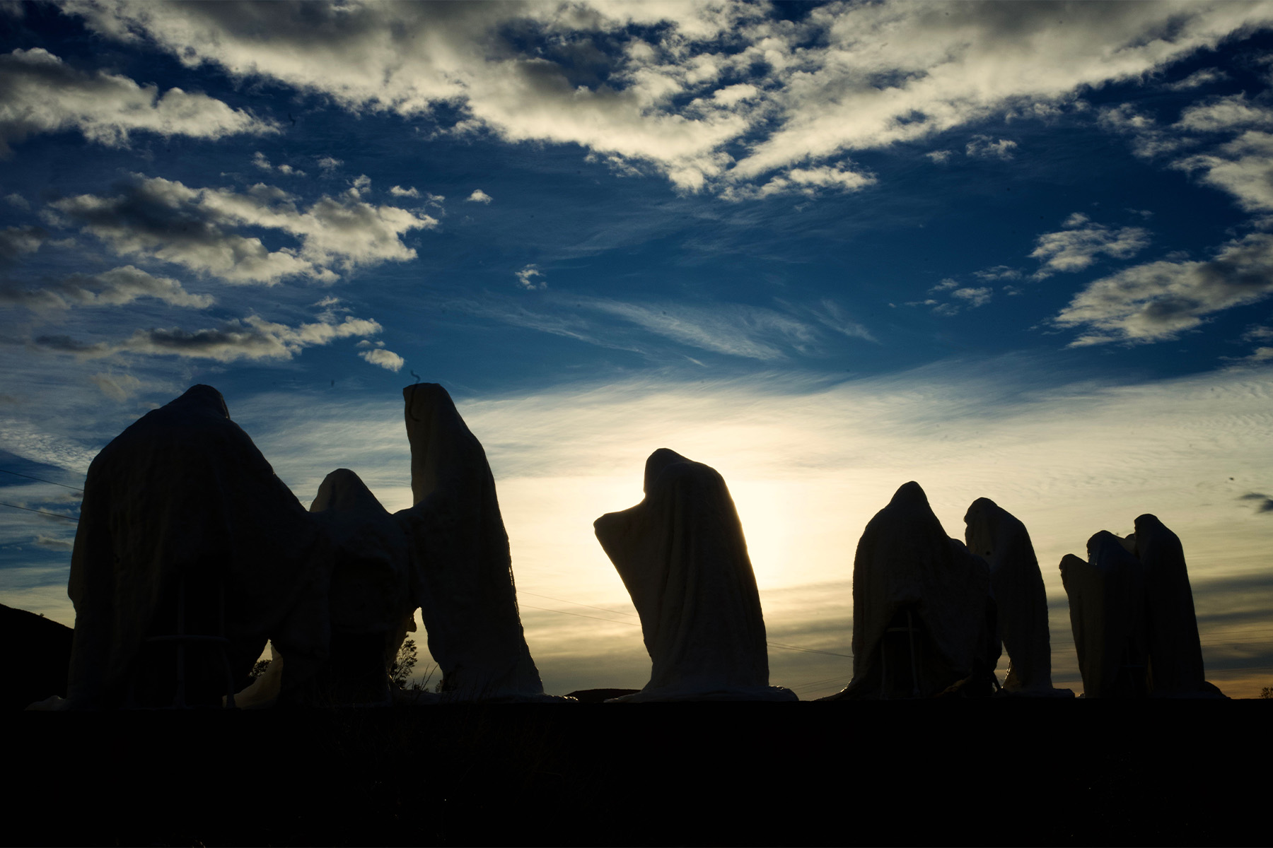 Ghost sculptures at sunrise, Goldwell Open Air Museum.