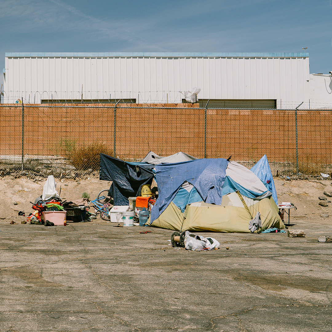 A homeless encampment beside an industrial building in the Las Vegas valley.