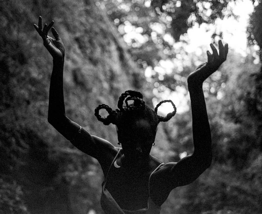 London Vasser, a close friend of Stevens’ family, poses for a photo as the imagined embodiment of Mother Nature at the Jackie Robinson Park in Harlem, N.Y. — a source of light and a mysterious, unidentifiable worldly force — felt more than seen.