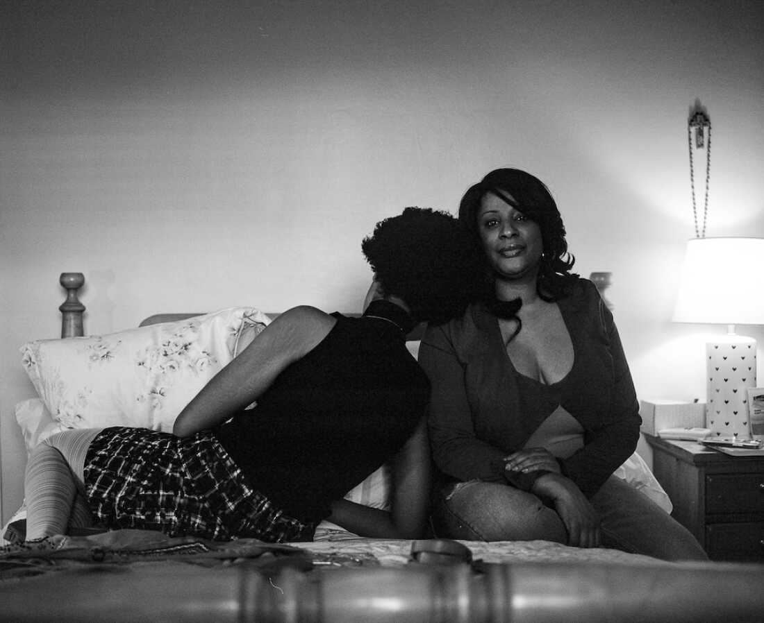 Mikaela Gumbel, 20, sits with her mother in Mikaela's childhood bedroom in Westchester County, N.Y.