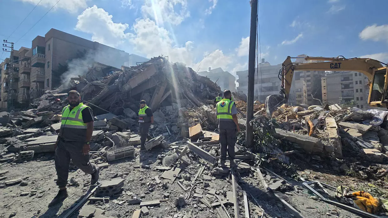 Lebanese civil defence workers search through the rubble of a building following an Israeli strike at dawn in the southern Lebanese area of al-Hosh, near the coastal city of Tyre on May 26, 2026.