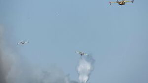 Canadair firefighting aircraft fight a wildfire burning near Pelayos de la Presa, 65 kilometers west of Madrid, on Sunday.