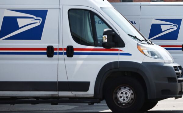 U.S. Postal Service (USPS) trucks are parked at a post office on Aug. 23, 2024 in Los Angeles, California.
