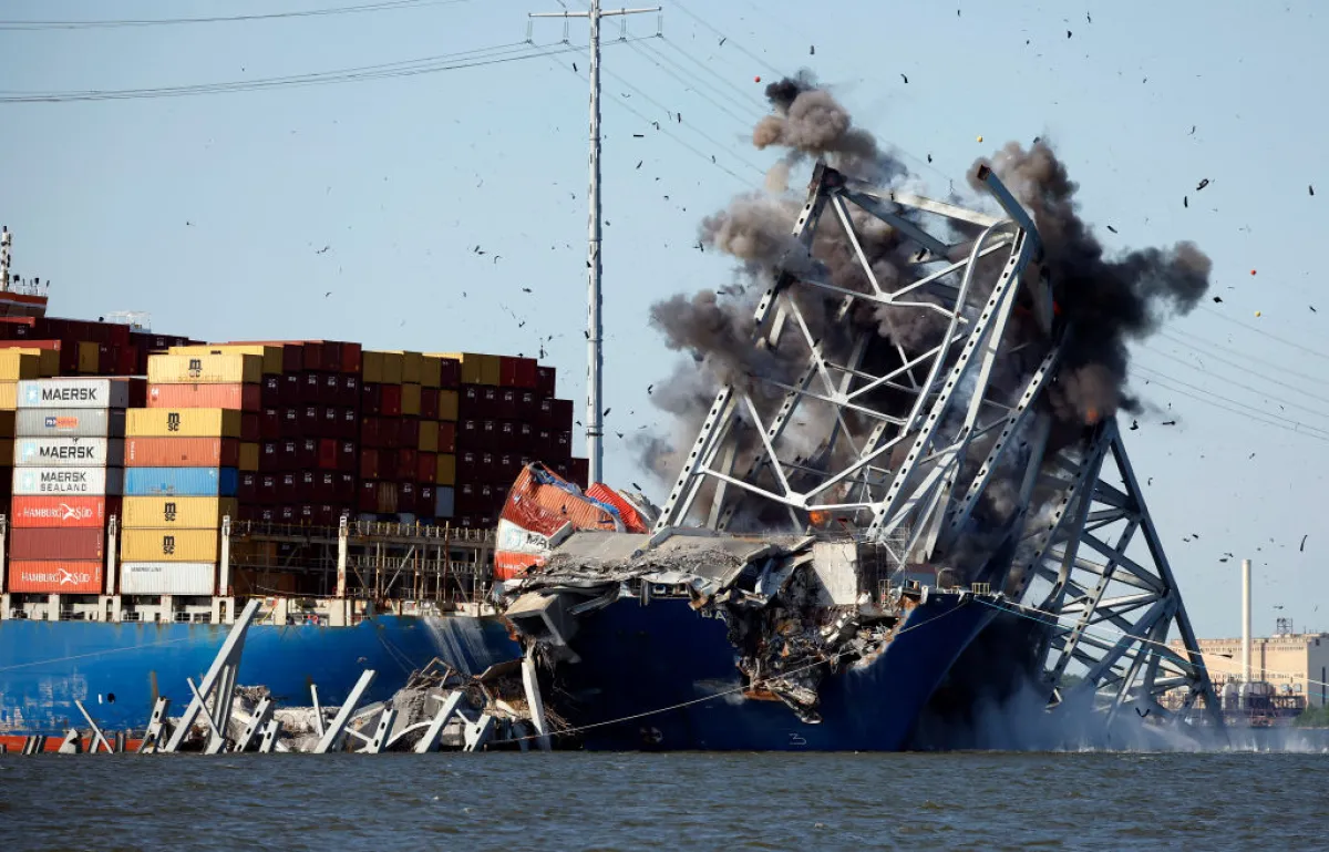 The Army Corps of Engineers sets off a controlled demolition to remove wreckage from the Francis Scott Key Bridge off of the cargo ship Dali in the Patapsco River on May 13 in Baltimore. An estimated 500-foot section of the bridge weighing 8-12 million pounds was removed by controlled demolition in the final stage of wreckage removal for the ship to be moved into port.