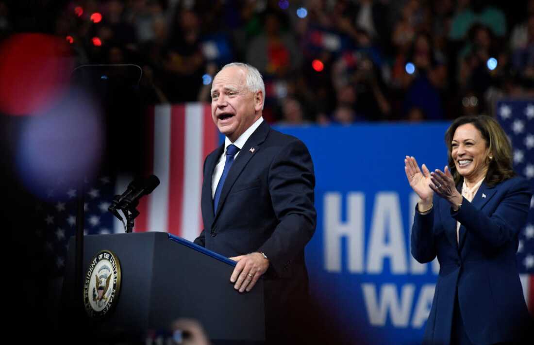 Vice President and Democratic presidential nominee Kamala Harris applauds as her running mate, Minnesota Gov. Tim Walz, speaks at Temple University's Liacouras Center in Philadelphia on Tuesday.