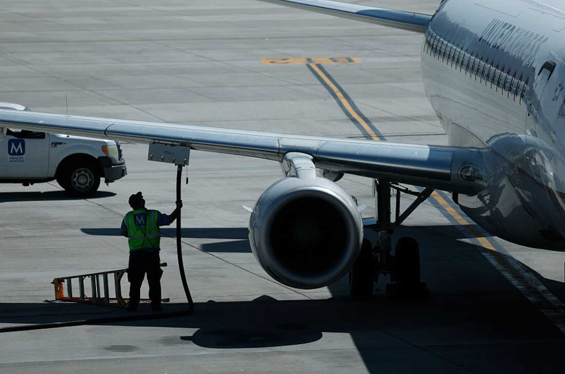 A worker fuels a United Airlines plane at Salt Lake City International Airport in April, 2026. The price of jet fuel, one of airlines’ biggest expenses, is close to an all-time high in the U.S.