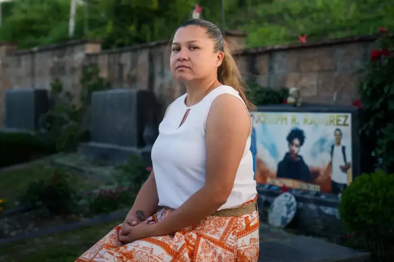 Gaudy Lemus, mother of Joseph Ramirez, visits his grave at Eternal Valley Memorial Park. Photo by Jules Hotz for CalMatters