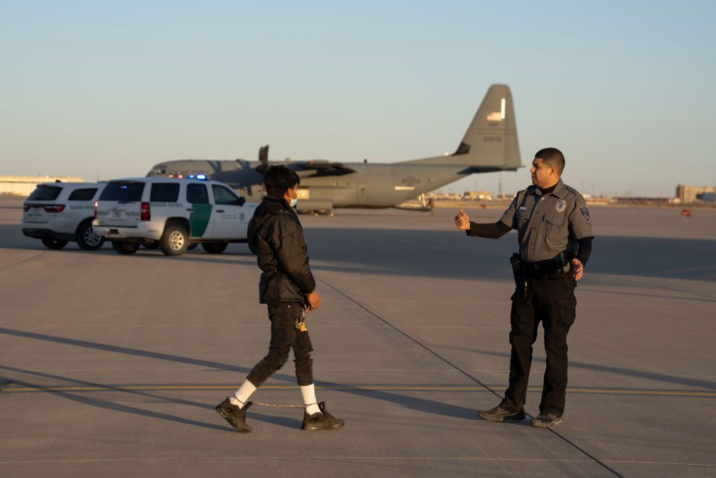 An immigrant prepares to board a military removal flight last month at Fort Bliss, near El Paso, Texas.