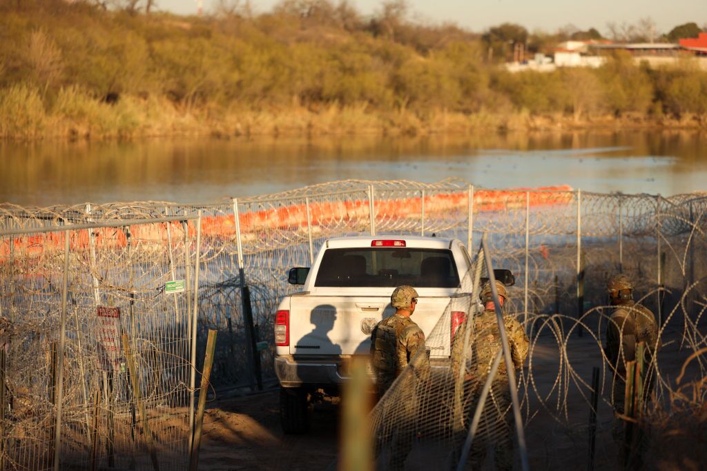 U.S. Army soldiers patrol the U.S.-Mexico border at Eagle Pass, Texas, on Jan. 24. The Trump administration has often used the word invasion to describe illegal immigration, but that framing has not been fully tested in court until now.