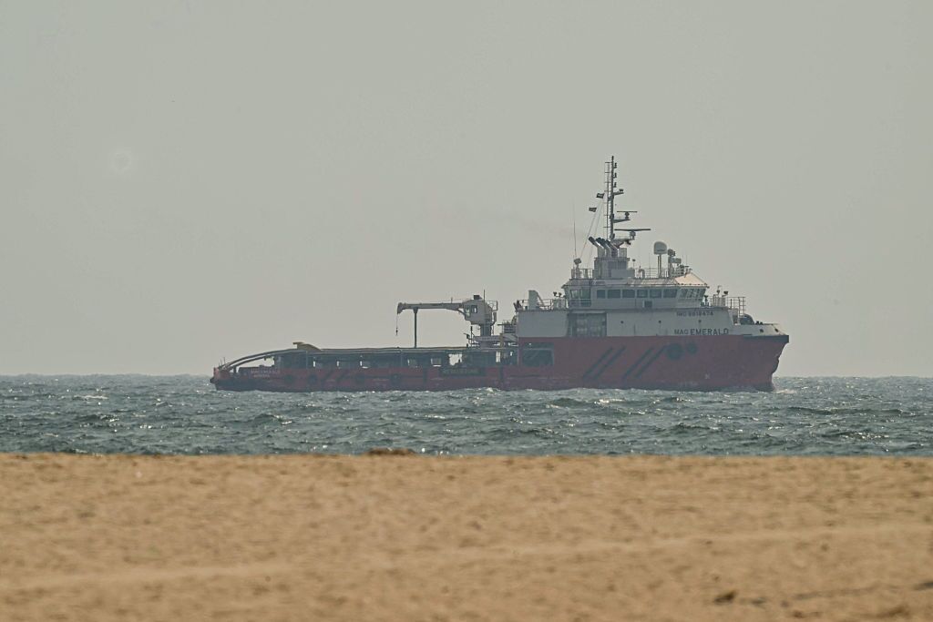 A ship sails off the coast of Ajman on July 10, 2026.