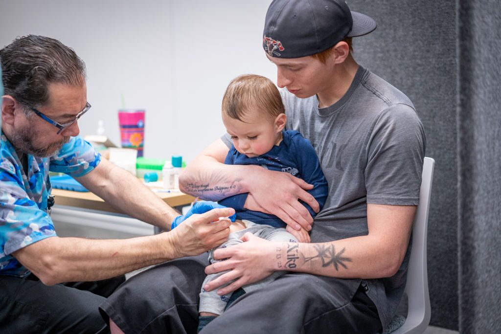 A toddler gets the MMR vaccine at a vaccine clinic in Lubbock, Texas, during the measles outbreak in that state earlier this year.
