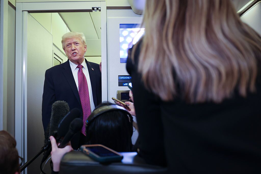 U.S. President Donald Trump speaks to members of the press aboard Air Force One on April 17, 2026 just prior to landing at Joint Base Andrews, Maryland.
