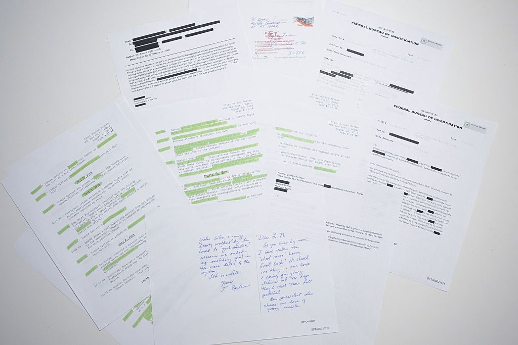 This photo illustration shows a new batch of files released in December by the U.S. government in relation to the late sex offender Jeffrey Epstein.