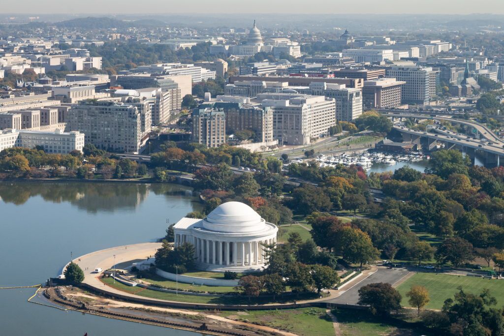 The Jefferson Memorial and US Capitol are seen alongside the Tidal Basin in an aerial photograph taken on approach to Ronald Reagan Washington National Airport near Washington, DC, on October 22, 2024.