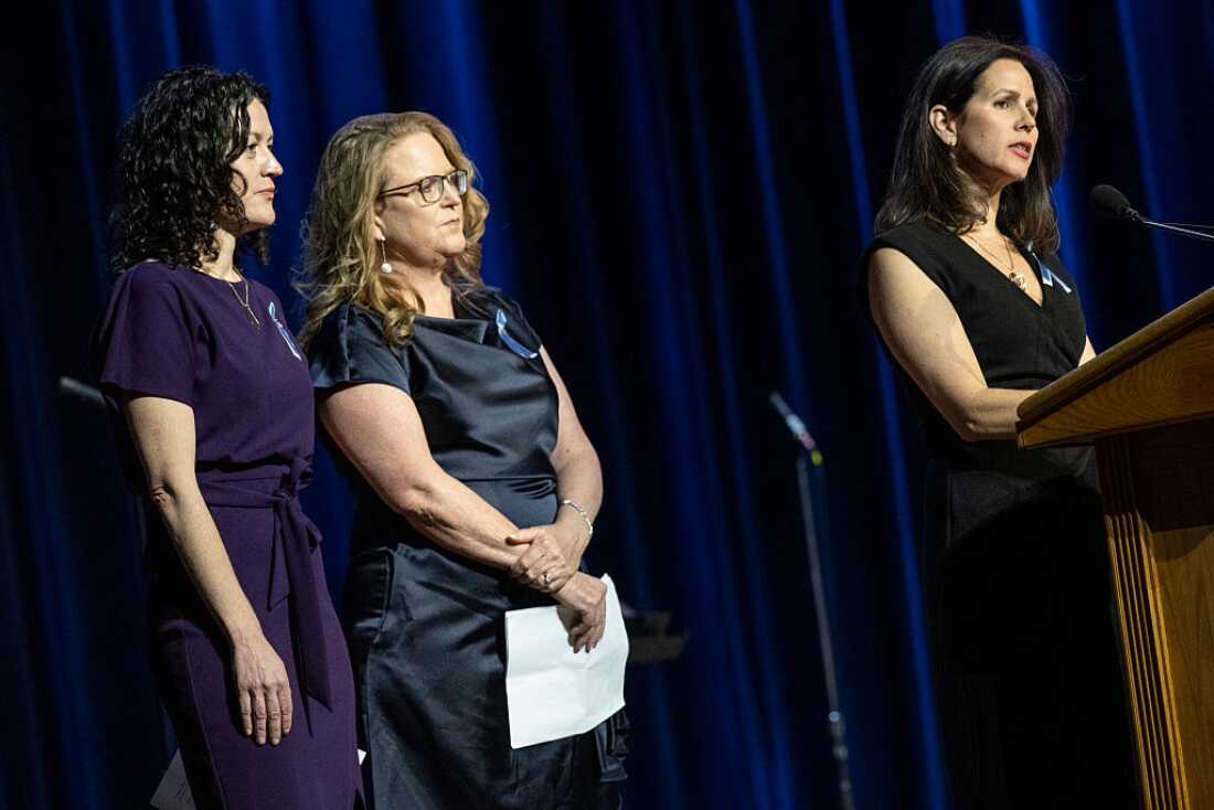 Rachel Feres (left) and other family members speak at a memorial event at DAR Constitution Hall in Washington, D.C. for the 67 people who were killed in the midair collision of a U.S. Army helicopter and an American Airlines regional jet a year ago.