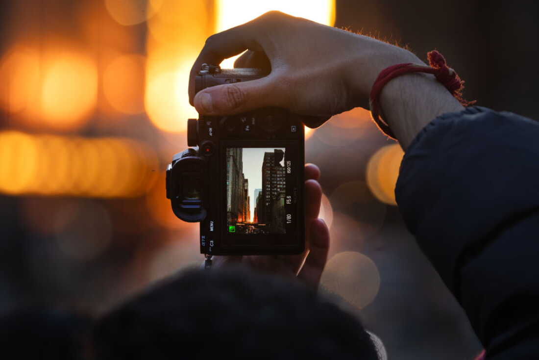 Photographers, tourists and residents gather downtown to view "Chicagohenge" on March 22, 2025, in Chicago.
