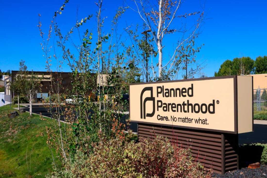 The Planned Parenthood sign outside the clinic in Pullman, Washington, is pictured against a cloudless, bright blue sky.