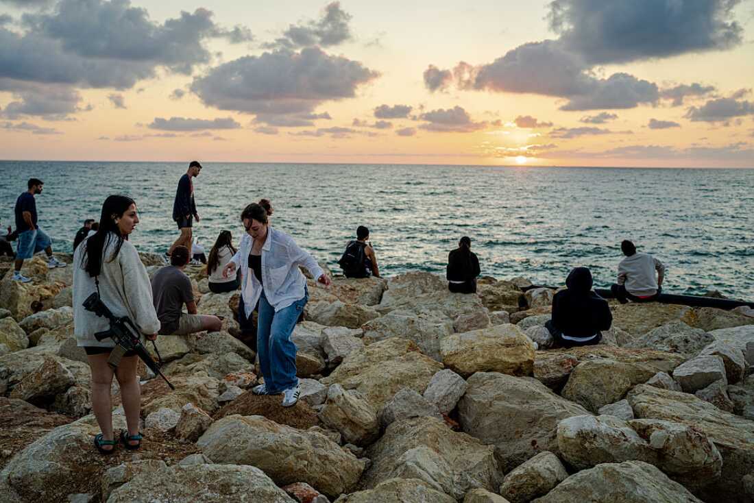 People enjoy the last day of Passover and the first day of the ceasefire on Wednesday in Tel Aviv, Israel.