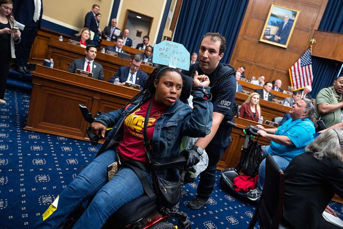 Demonstrators calling for preservation of Medicaid funding, are removed from the House Energy and Commerce markup of the budget resolution in Rayburn building on Tuesday, May 13, 2025.