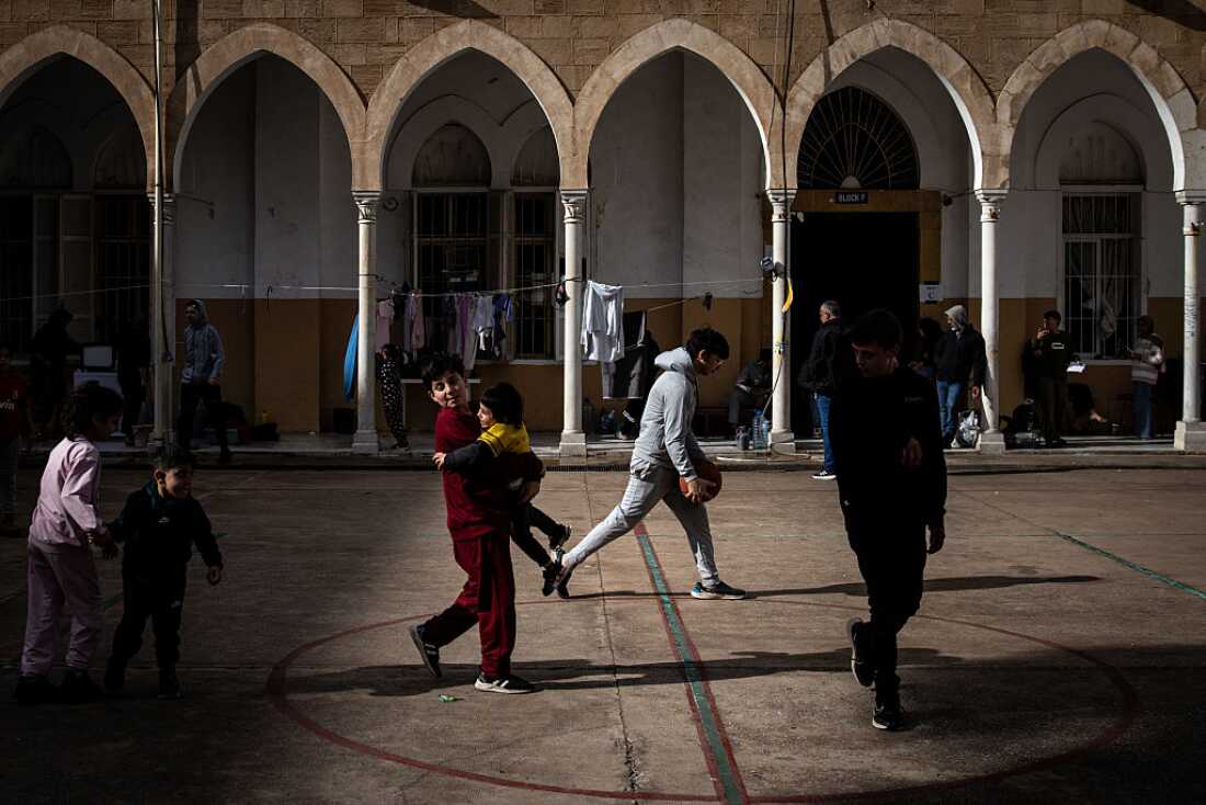 Children play in the courtyard of a school that has been turned into a temporary displacement camp on March 29, 2026 in Beirut, Lebanon.