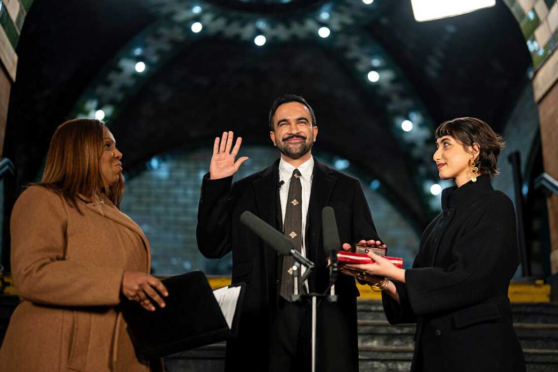 Zohran Mamdani is sworn in as New York City's 112th mayor by New York Attorney General Letitia James, left, alongside his wife Rama Duwaji, right, in the former City Hall subway station on January 1, 2026 in New York City.