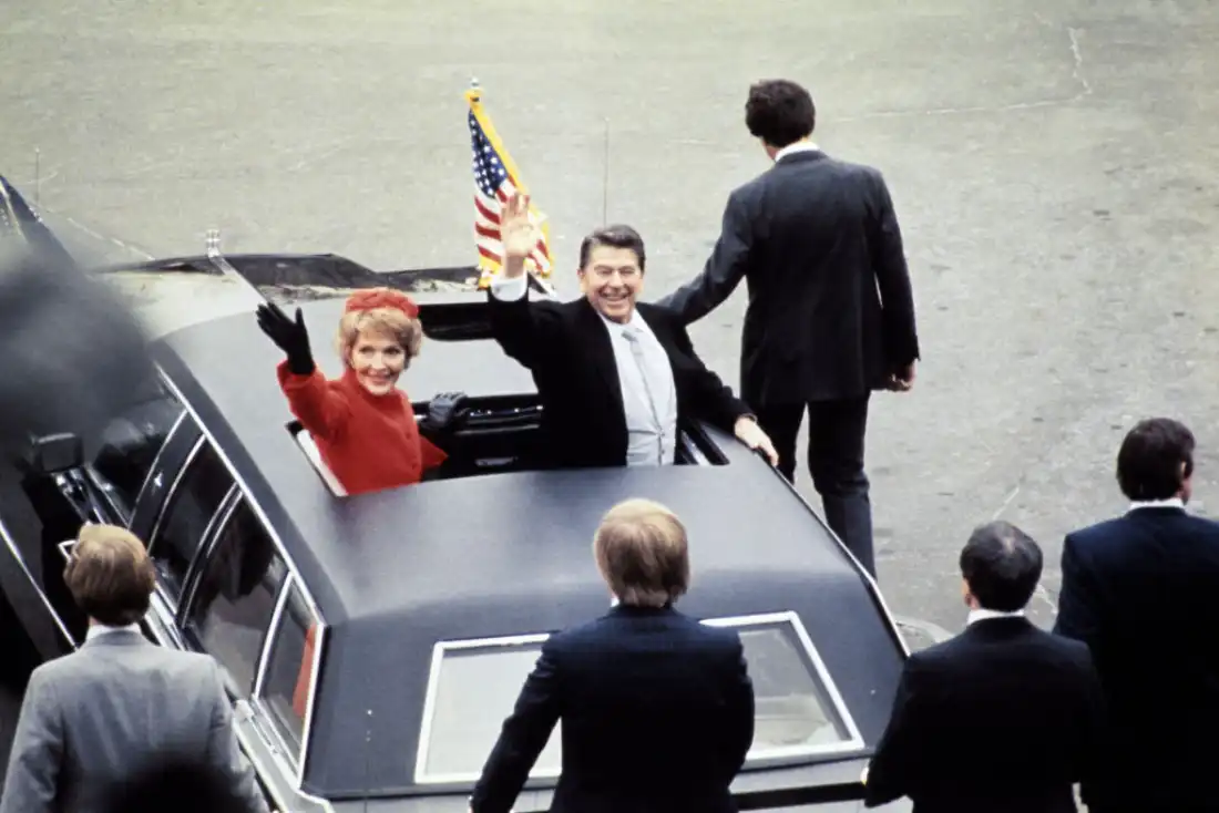 President Ronald Reagan waves beside his wife, Nancy Reagan, after being sworn in as 40th president of the United States by Chief Justice Warren Burger on Jan. 20, 1981, at the Capitol in Washington, D.C.