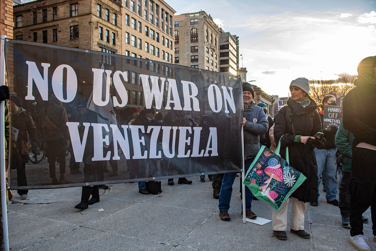 People demonstrate against US military action in Venezuela in Boston Common on January 3. 2026 in Boston, Massachusetts.