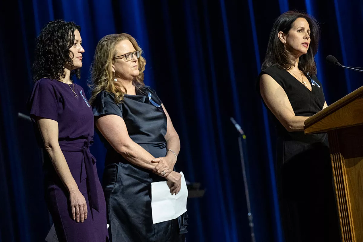 Rachel Feres (left) and other family members speak at a memorial event at DAR Constitution Hall in Washington, D.C. for the 67 people who were killed in the midair collision of a U.S. Army helicopter and an American Airlines regional jet a year ago.