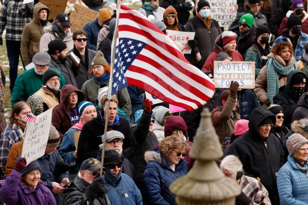 People protest against President Donald Trump and Elon Musk outside the Michigan Capitol in Lansing, Mich., on Feb.5.