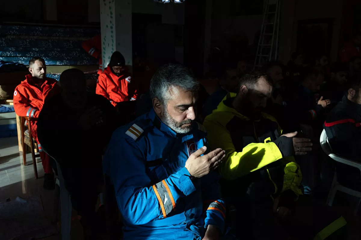 Mohammed Suleiman weeps as he prays with his comrades during an Ashura ceremony held in memory of his son, Joud, and his friend Ali Hassan Jaber, who were killed in an Israeli drone strike while riding a motorbike behind an ambulance in Nabatieh, Lebanon, on March 27, 2026.