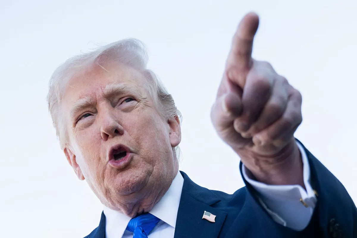 US President Donald Trump speaks to reporters before boarding Air Force One at Palm Beach International Airport in West Palm Beach, Florida, on March 23, 2026.