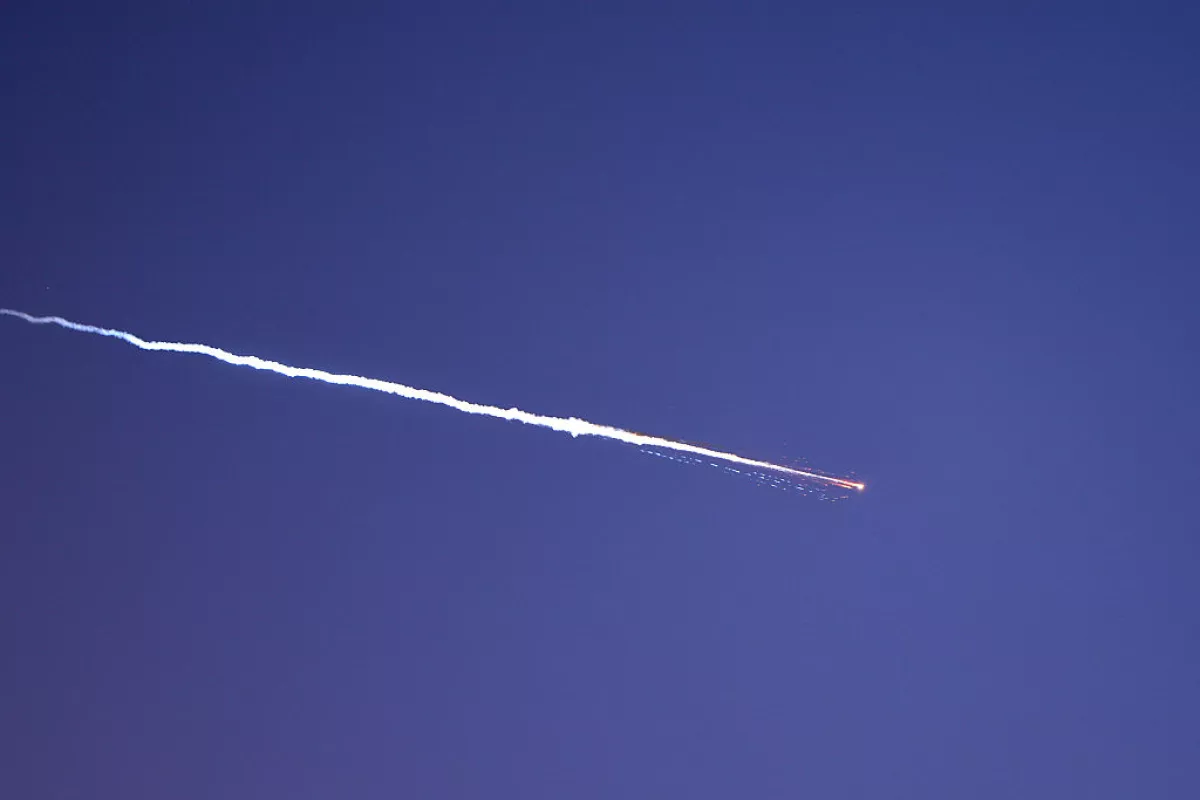 Rocket trails are seen in the sky above the Israeli coastal city of Netanya amid a fresh barrage of Iranian missile attacks on March 28, 2026.