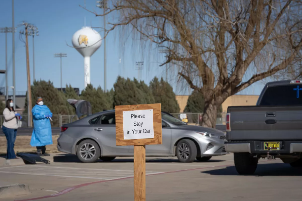 Signs point the way to measles testing in the parking lot of the Seminole Hospital District across from Wigwam Stadium on February 27, 2025 in Seminole, Texas.