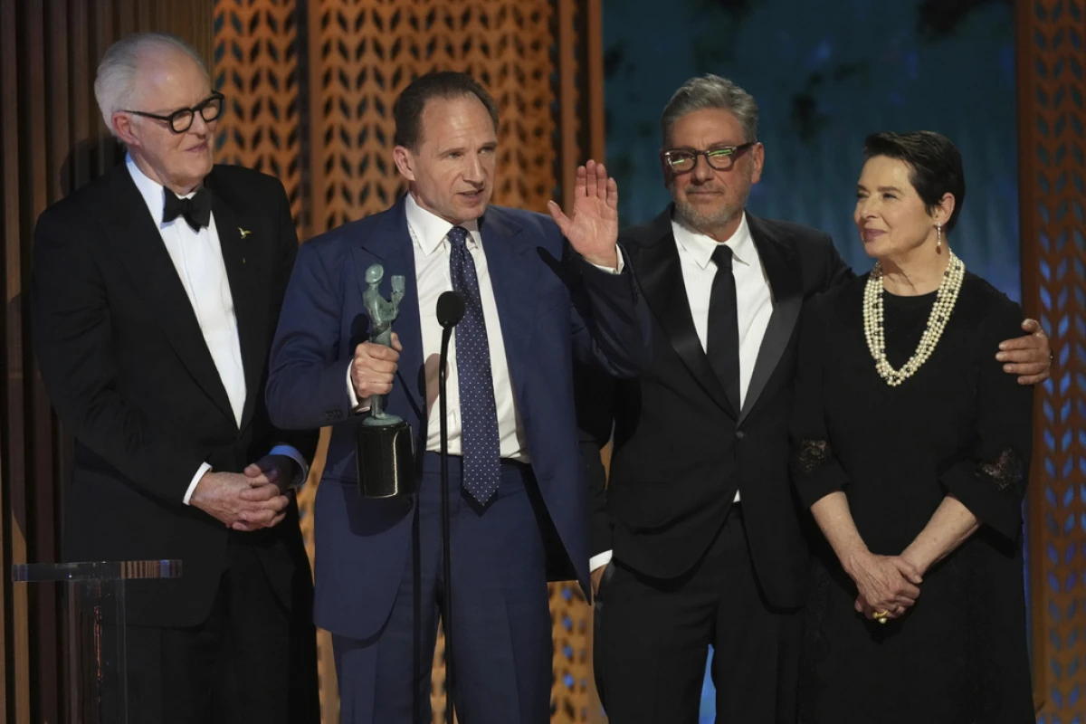 John Lithgow, from left, Ralph Fiennes, Sergio Castellitto, and Isabella Rossellini accept the award Sunday for outstanding performance by a cast in a motion picture for 'Conclave' during the 31st annual Screen Actors Guild Awards at the Shrine Auditorium in Los Angeles.