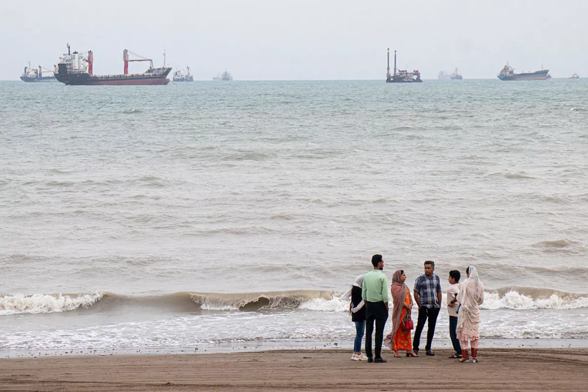 In this picture obtained from Iran's ISNA news agency on April 24, 2026, Iranians are seen at Suru Beach in Bandar Abbas along the Strait of Hormuz.