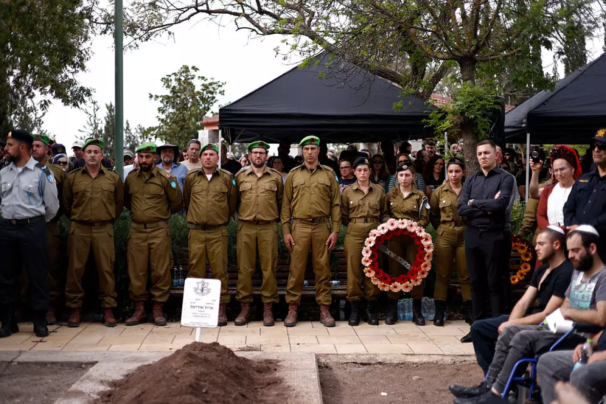 Comrades, relatives and friends of Sgt. Maj. (Res.) Ayal Uriel Bianco, who was reportedly killed in combat in southern Lebanon, attend his funeral in Katzrin in the Israeli-annexed Golan Heights on Tuesday.