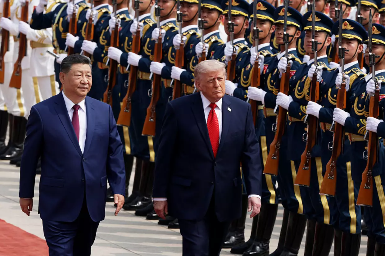 U.S. President Donald Trump reviews an honor guard with Chinese President Xi Jinping during a welcome ceremony at the Great Hall of the People on May 14, 2026 in Beijing, China.