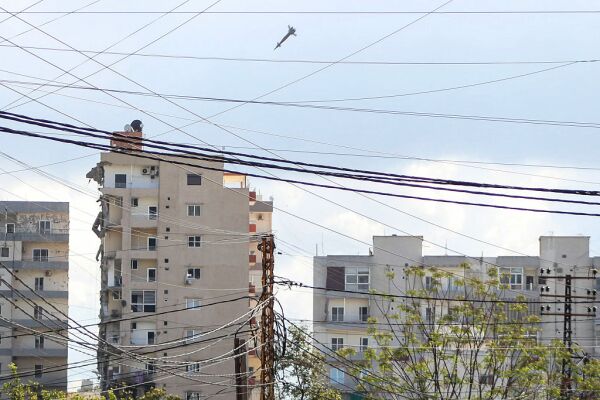 A projectile is seen moments before hitting a building during an Israeli airstrike in the area of Abbasiyeh, on the outskirts of the southern Lebanese city of Tyre, on April 8, 2026.