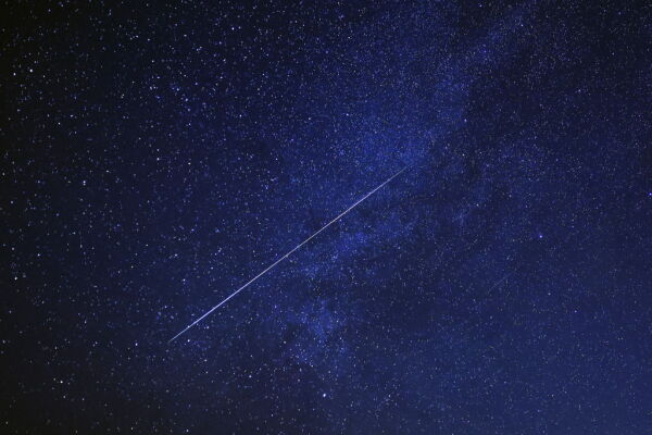 A meteor burns up in the sky over al-Abrak desert north of Kuwait City during the annual Geminid meteor shower early on Dec. 15, 2023.