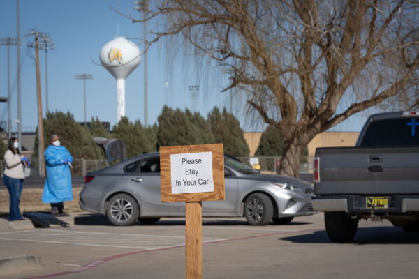 Signs point the way to measles testing in the parking lot of the Seminole Hospital District across from Wigwam Stadium on February 27, 2025 in Seminole, Texas.