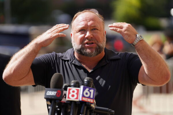 InfoWars founder Alex Jones speaks to the media outside Waterbury Superior Court during his trial on September 21, 2022 in Waterbury, Connecticut in which he was being sued by several victims' families for causing emotional and psychological harm after they lost their children in the Sandy Hook massacre.