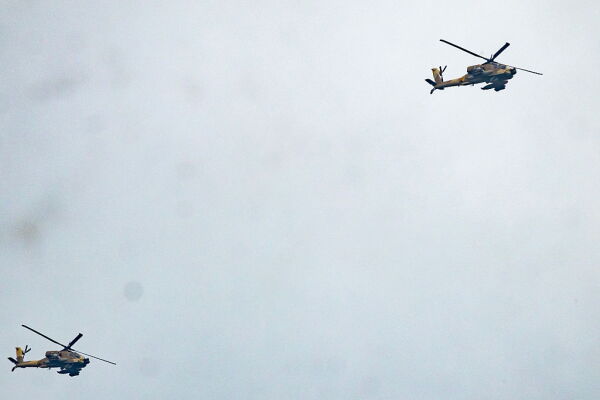 Israeli helicopter gunships fly along the Lebanon-Israel border in the Upper Galilee in northern Israel on March 22, 2026.