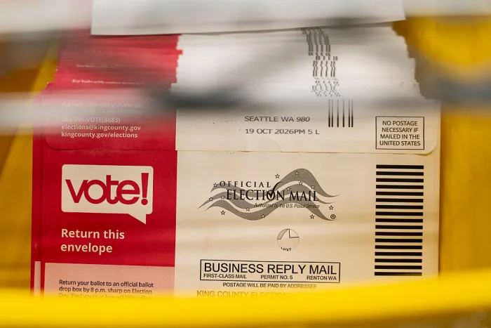 Ballot envelopes sit in a bin during the processing of ballots for the midterm elections at the King County Elections headquarters on October 23, 2026 in Renton, Washington. Workers have already begun processing ballots in Washington, which uses mail-in voting.