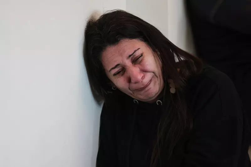 A relative of Hassan Ali Badawi, a paramedic with the Lebanese Red Cross who was killed the previous day in an Israeli airstrike, mourns as the family receives condolences at their home in the Bchamoun area south of Beirut, on Monday.